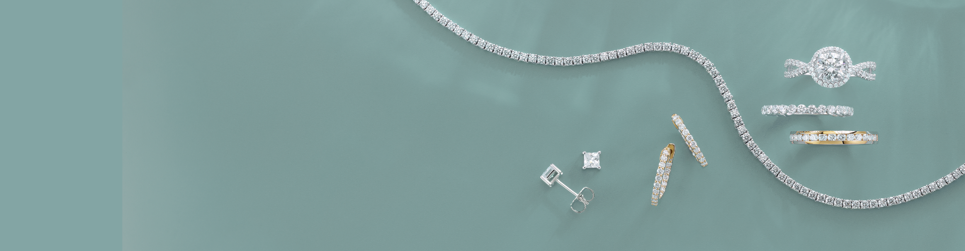 A variety of yellow and white gold diamond April birthstone jewellery.